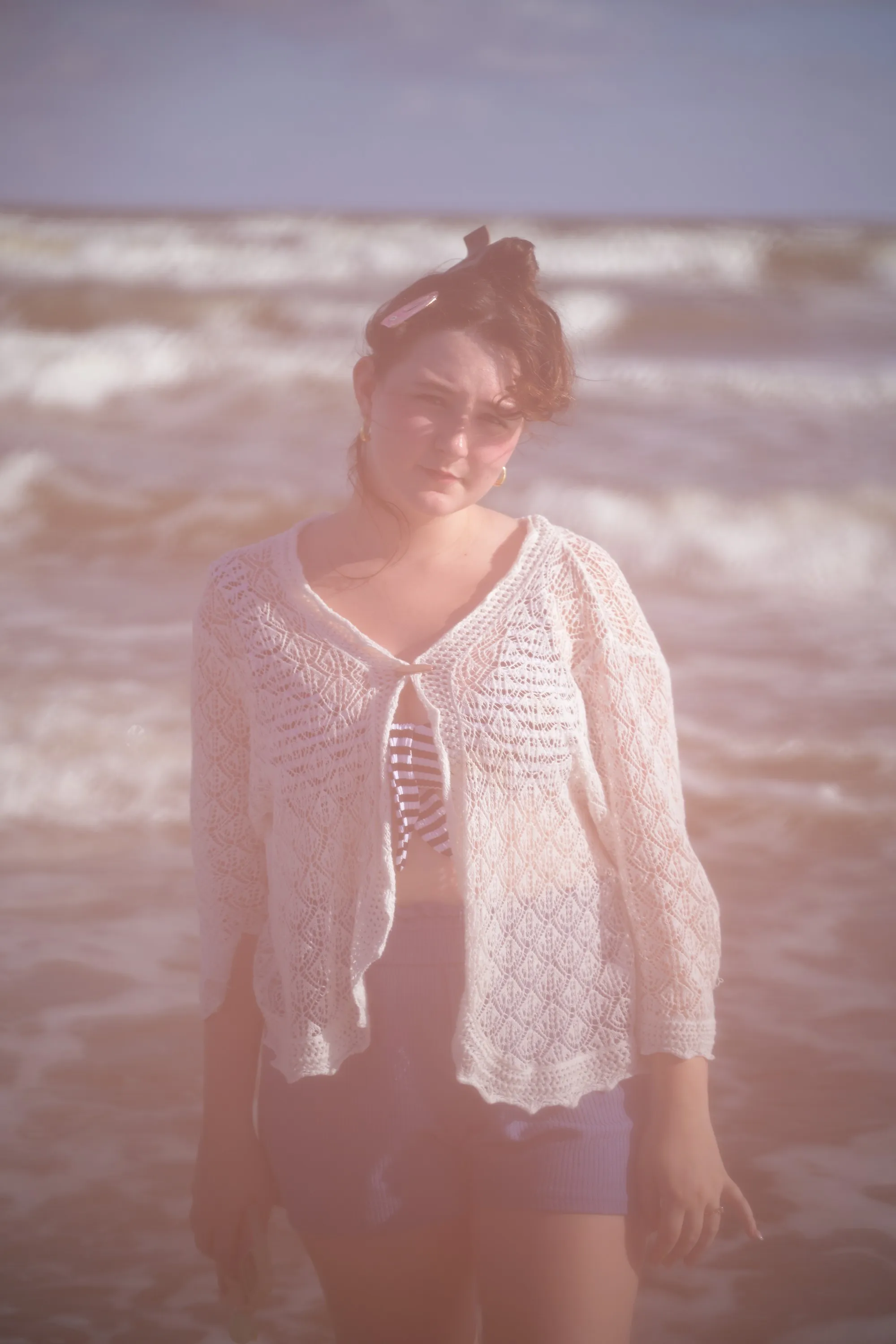 Overexposed pastel portrait by the shore — lace, sand and backlight — 2
