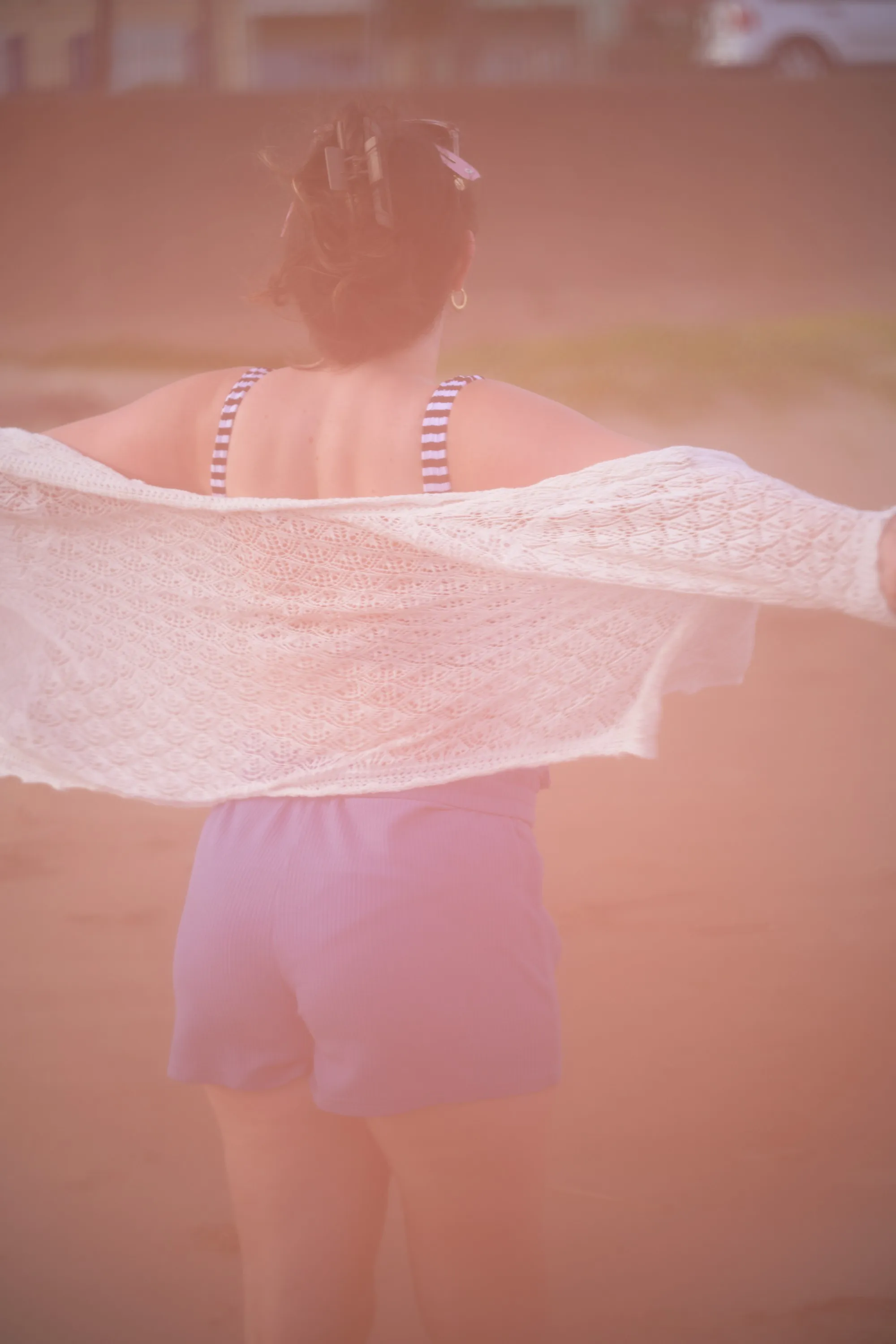 Overexposed pastel portrait by the shore — lace, sand and backlight — 5